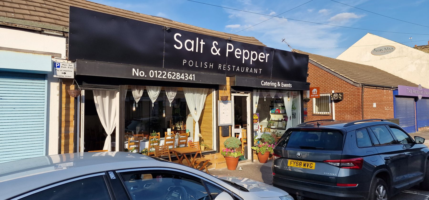The Salt & Pepper shopfront on Doncaster Road, Barnsley: a black fascia with white lettering above a timber-clad window and planters.